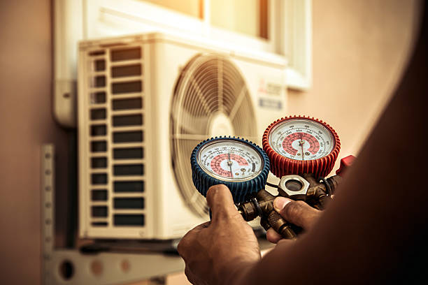 Professional Hvac technician working in Newton Highlands, MA